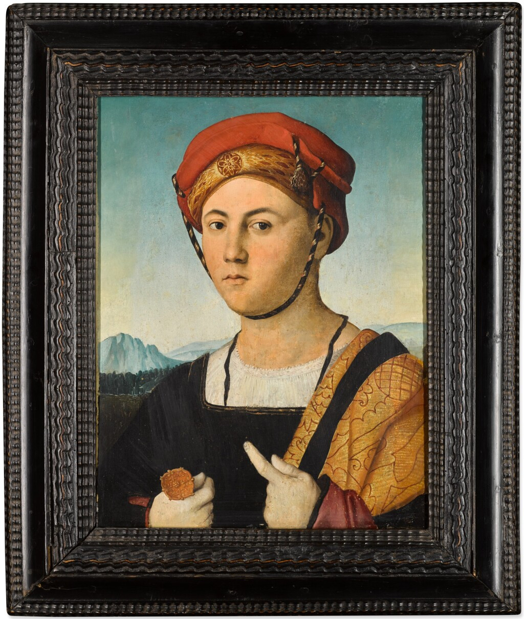 3 Portrait of a man, half-length, wearing a red hat and gold brocade cloak, holding a dagger, a landscape beyond.jpg